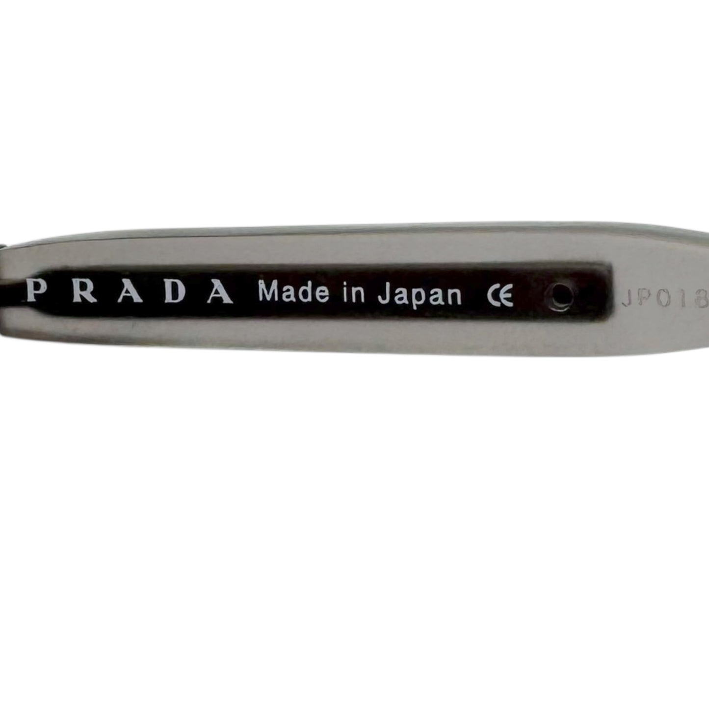 Prada 59017 Silver Rimless Sunglasses