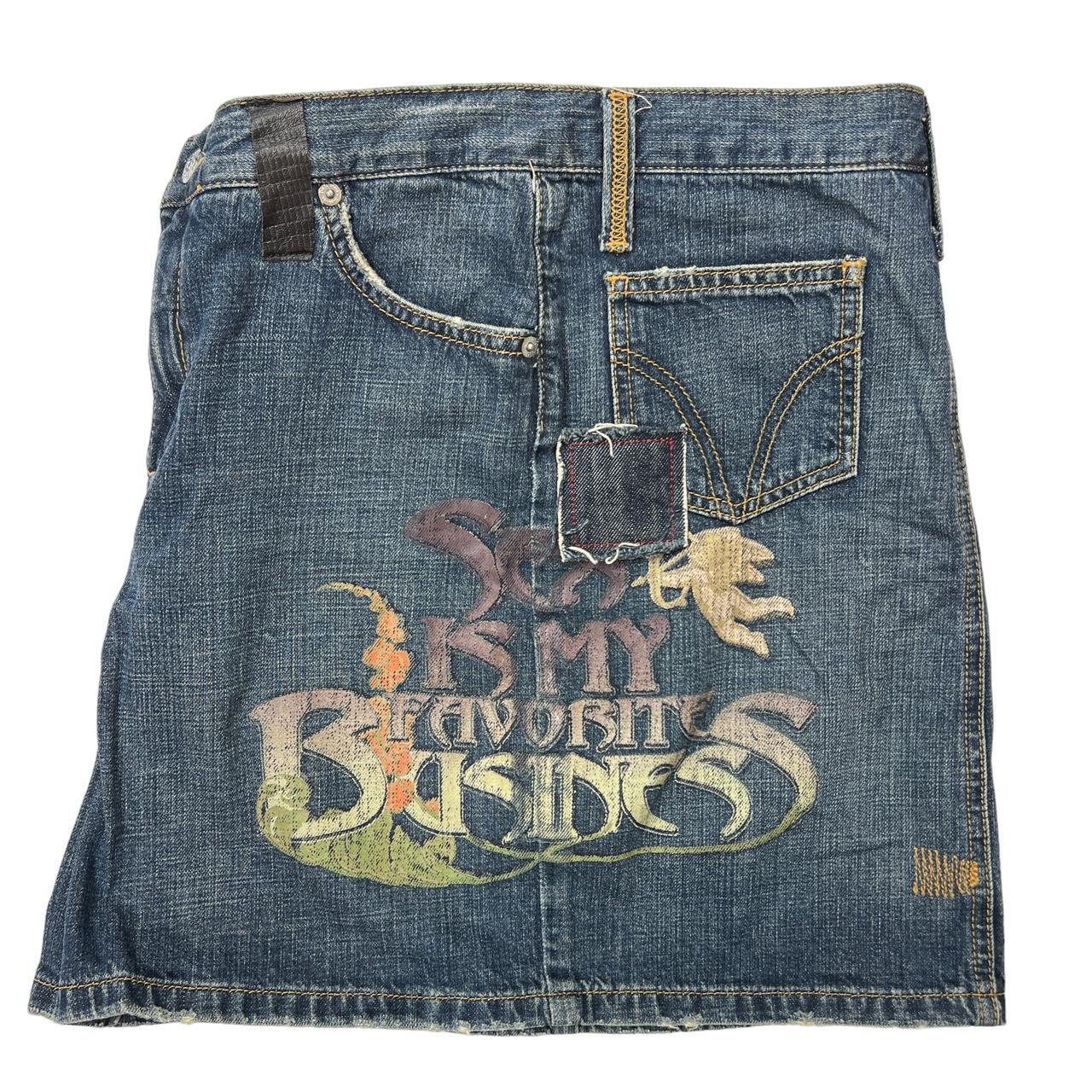 Dolce & Gabbana 'Sex is My Favorite Business' Graphic Distressed Denim Mini Skirt with Leather Logo Patch and Pocket - Outfit Repeater