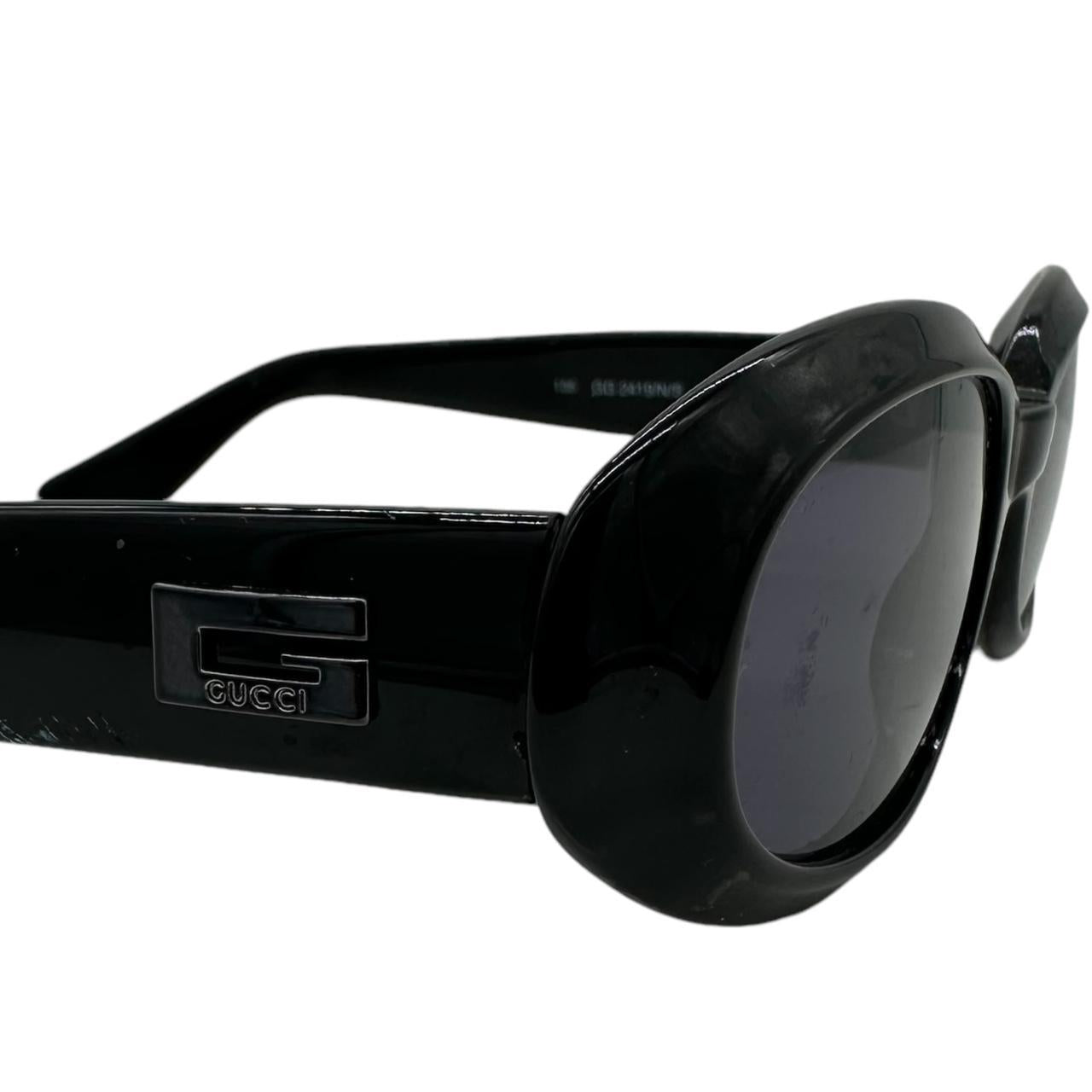 Gucci Black Oval Sunglasses with Dark Tinted Lenses